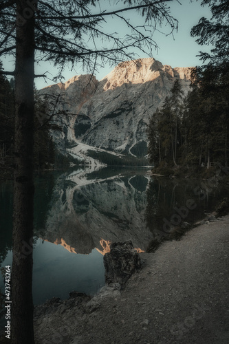 landscape of a lake surrounded by mountains and trees