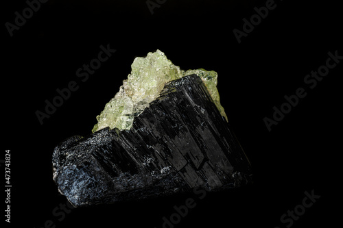 Macro stone Hyalite mineral, tourmaline Sherl, smoky quartz on a black background photo