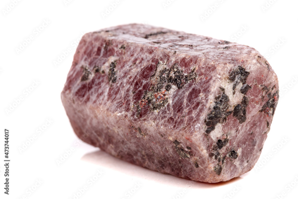 Macro mineral stone Ruby in the breed a white background Macro mineral stone Ruby in the breed a white background