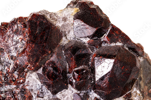 Macro stone garnet mineral on white background