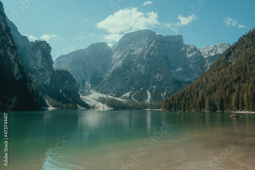 landscape of a lake surrounded by mountains and trees