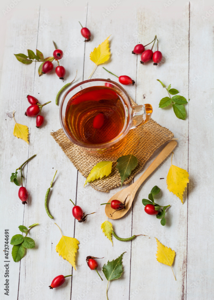 Rosehip tea on a wooden background 