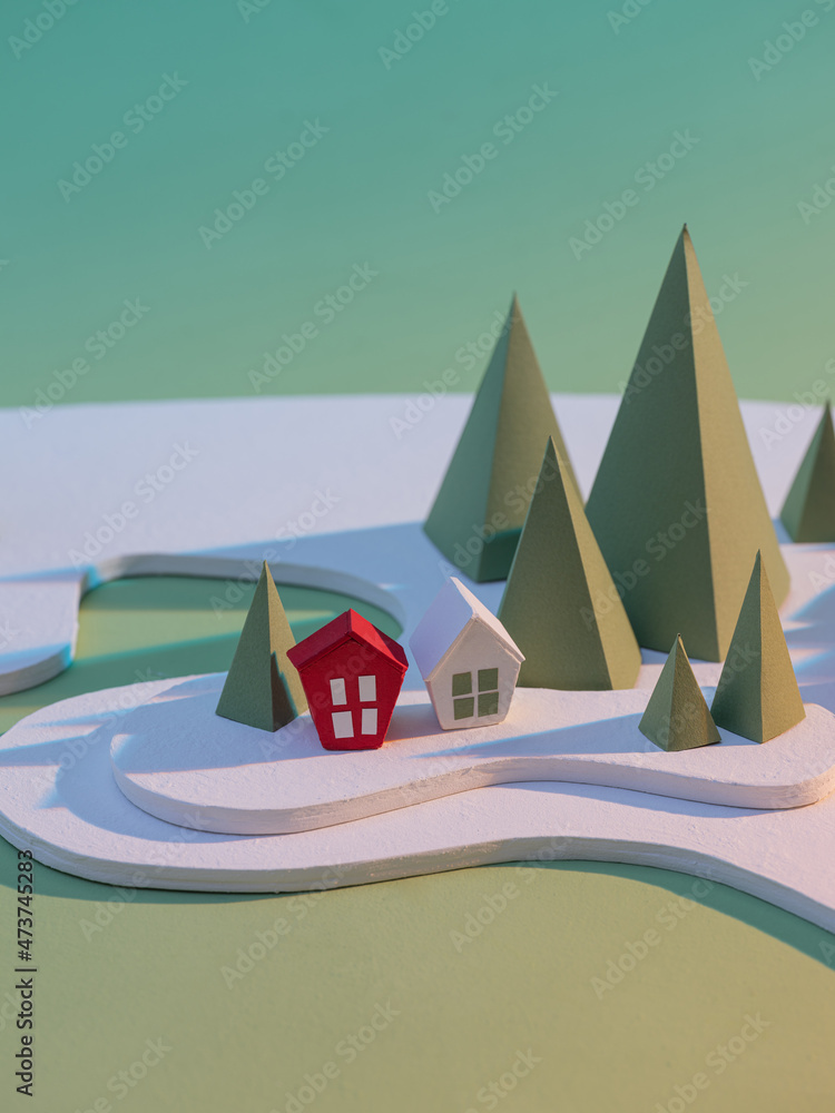 Handmade red paper village with green background. Handmade red paper village with green background.