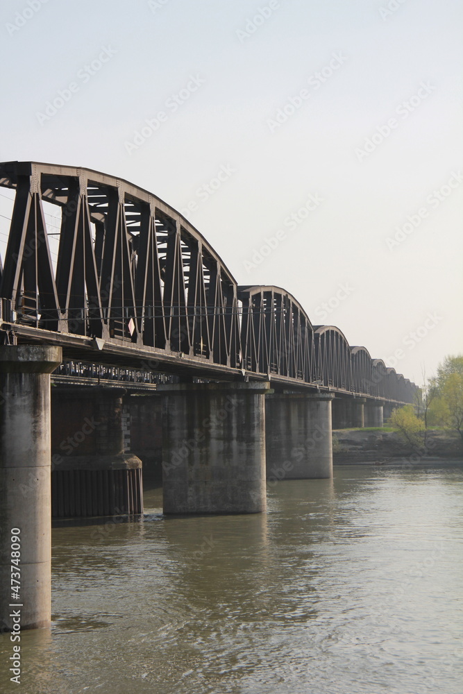 Fototapeta premium Iron bridge on the Po river in Italy