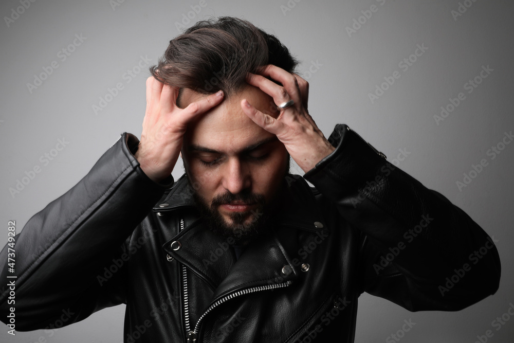 Sad and upset bearded young man, posing over white background. Sad and upset bearded young man, posing over white background.