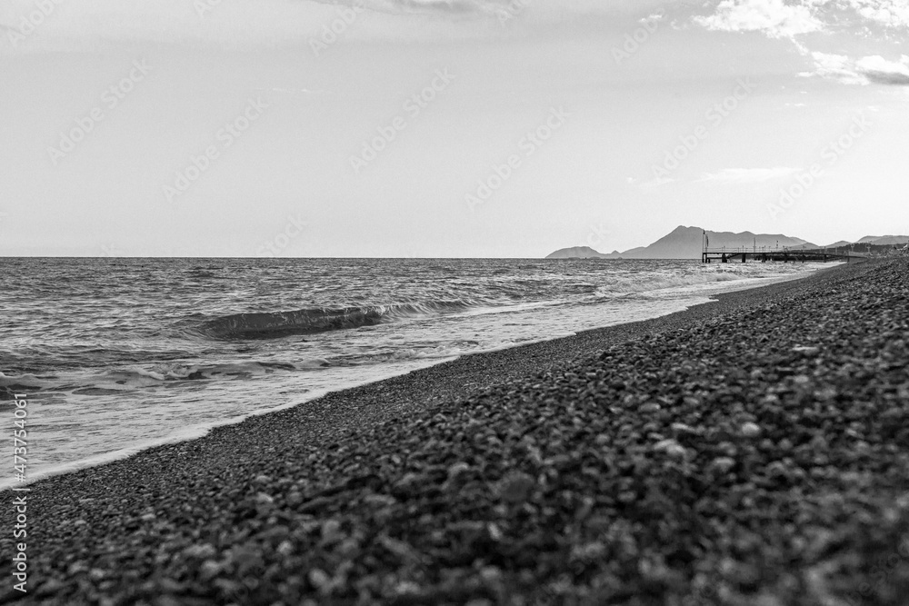 black and white sea beach with pebbles black and white sea beach with pebbles