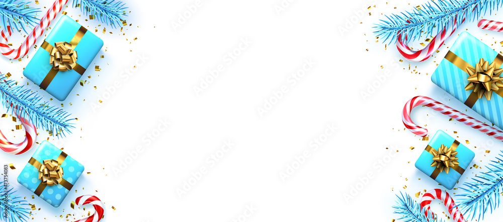 Obraz premium Striped candy cane sticks with blue fir branches, gift boxes and golden confetti.