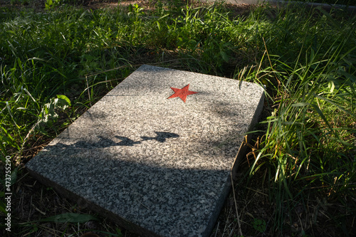 Swietajny, Poland - July 21, 2021: Cemetery of soldiers (prisoners of war from Stalag I-B Hohenstein) from World War II. Selective focus. Summer sunny day photo