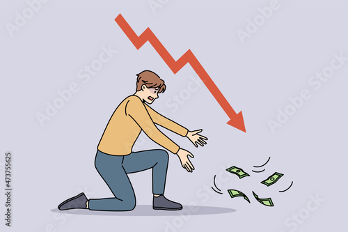 Financial crisis and regression concept. Stressed young businessman sitting on knee trying to get reach flying away money with arrow down vector illustration 