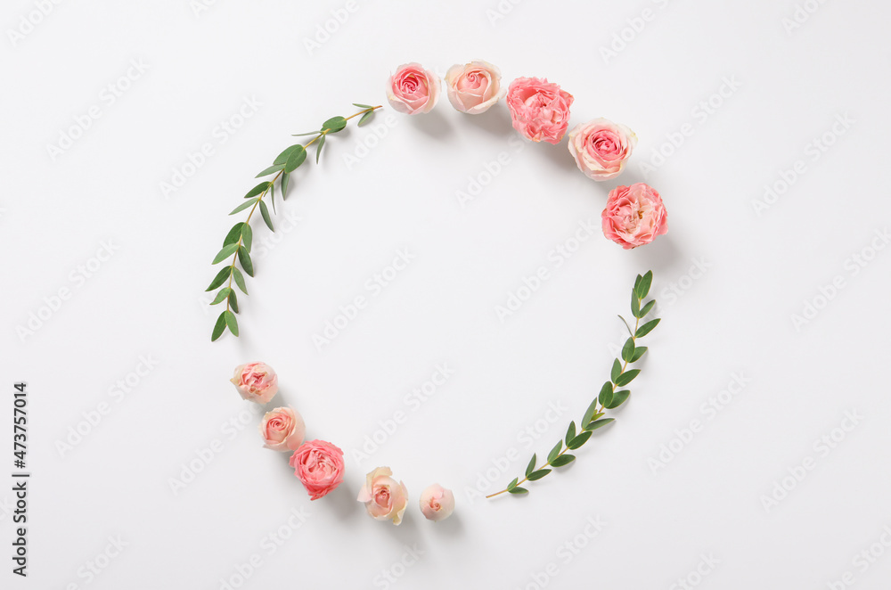 Beautiful wreath made of rose flowers and eucalyptus on white background, flat lay Beautiful wreath made of rose flowers and eucalyptus on white background, flat lay