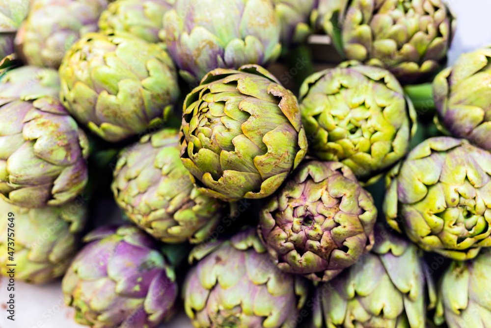 Veggetable and fruit market Campo di Fiori at Rome. tradtional italian food .Fresh artichokes close up Veggetable and fruit market Campo di Fiori at Rome. tradtional italian food .Fresh artichokes close up