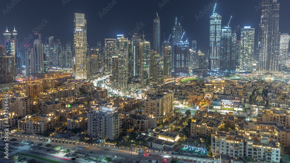 Futuristic aerial night cityscape timelapse with illuminated architecture of Dubai downtown, United Arab Emirates. Futuristic aerial night cityscape timelapse with illuminated architecture of Dubai downtown, United Arab Emirates.