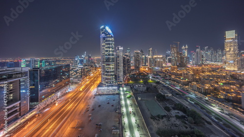 Dubai's business bay towers aerial night timelapse. Rooftop view of some skyscrapers