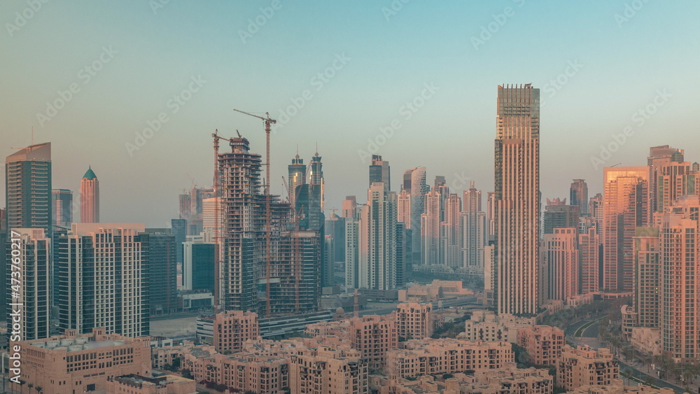 Obraz premium Dubai's business bay towers aerial morning timelapse. Rooftop view of some skyscrapers