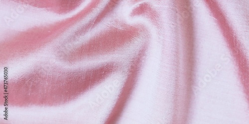 Pink natural silk lined with folds, background for romantic congratulation, emotion of love