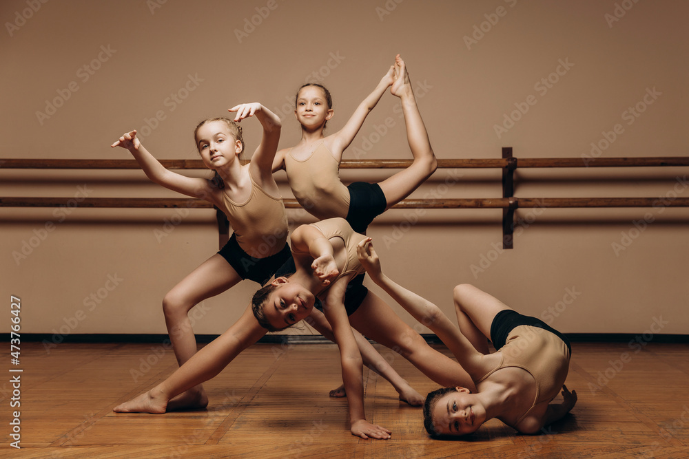 Black and white image of a group of modern little ballerinas standing in a modern dance pose. Copy space Black and white image of a group of modern little ballerinas standing in a modern dance pose. Copy space