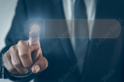 Business man hand finger touching on touchscreen search bar networking data website 