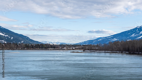 Wallpaper Mural wide Columbia river with snow in mountains blue sky early spring British Columbia Canada Torontodigital.ca