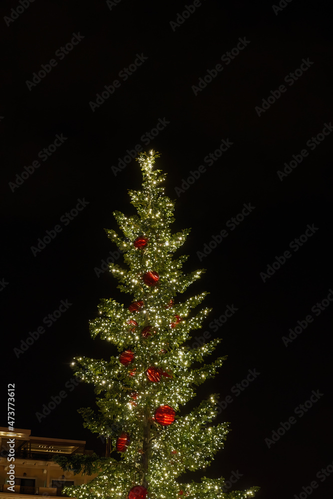 Decorated Christmas tree at Aristotelous square in Thessaloniki, Greece. Night view of illuminated festive installments at southern part of main city square, without crowd. Decorated Christmas tree at Aristotelous square in Thessaloniki, Greece. Night view of illuminated festive installments at southern part of main city square, without crowd.