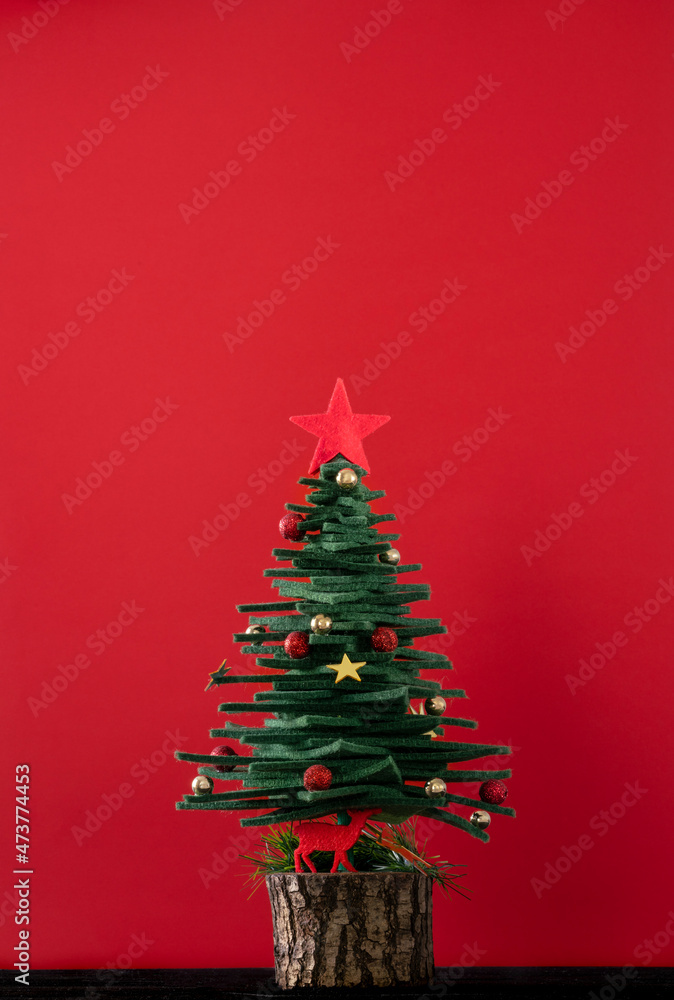 decorated Christmas tree on red background decorated Christmas tree on red background