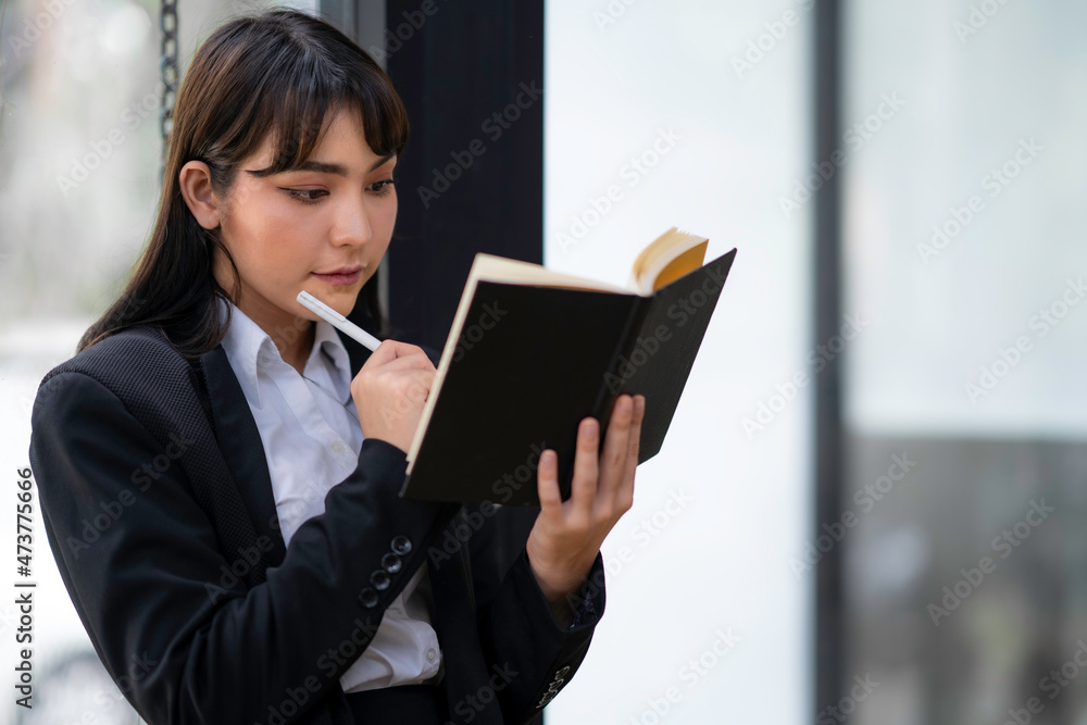 Portrait of a business woman thinking about investing, analytical thinking to maximize profits, planning ideas.