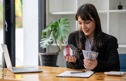 Portrait of a real estate agent or buyers are offering discounts on home insurance Sign a contract to buy and sell a house. Sign a contract. Signing concept. © crizzystudio