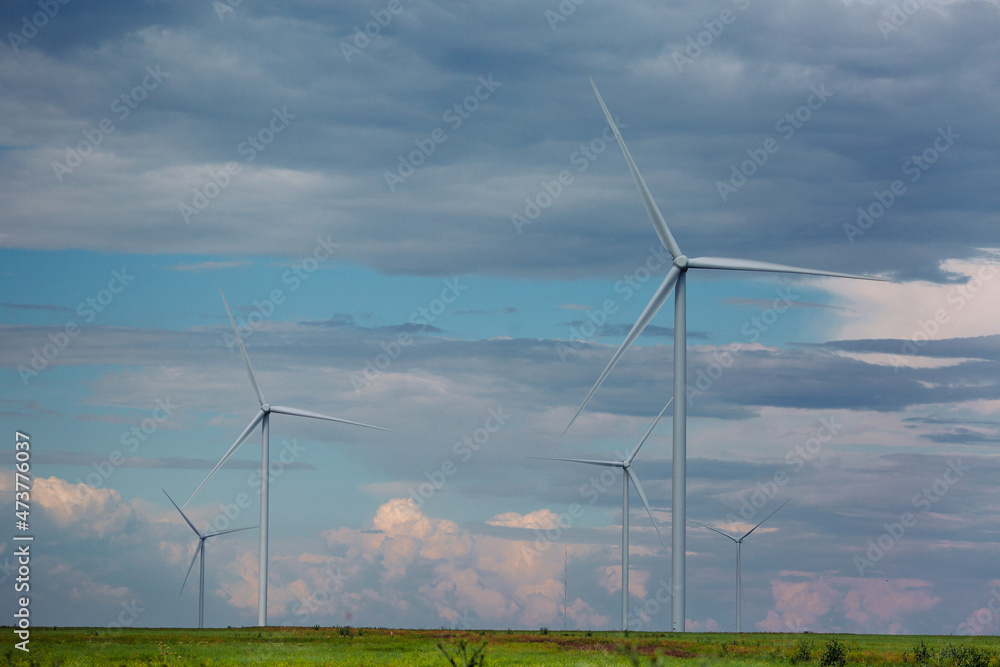 Wind turbines renewable energy source in the fields against the background of clouds Wind turbines renewable energy source in the fields against the background of clouds