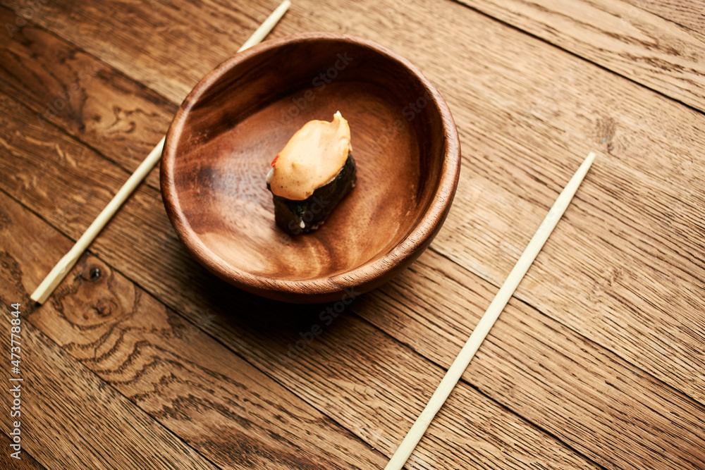 sushi on wooden plates chopsticks Japanese cuisine Asia Fish sushi on wooden plates chopsticks Japanese cuisine Asia Fish