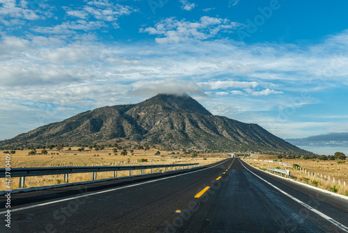 Empty road leading towards El Pizarro volcano, Puebla, Mexico photo