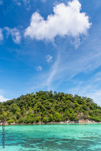 Beautiful Andaman sea, Tropical Turquoise clear blue sea and blue sky background at Lipe Island, Satun, Thailand - summer vacation travel