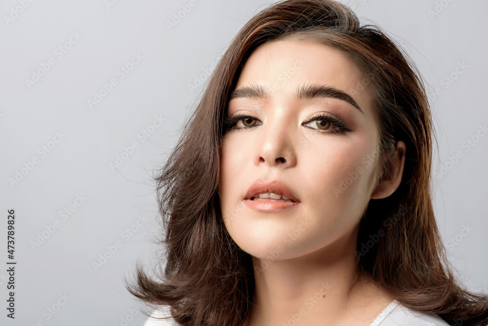 Beautiful female model . High fashion portrait sits in a light studio., isolated on white background. Beautiful female model . High fashion portrait sits in a light studio., isolated on white background.