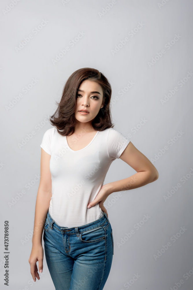 Beautiful female model . High fashion portrait sits in a light studio., isolated on white background. Beautiful female model . High fashion portrait sits in a light studio., isolated on white background.