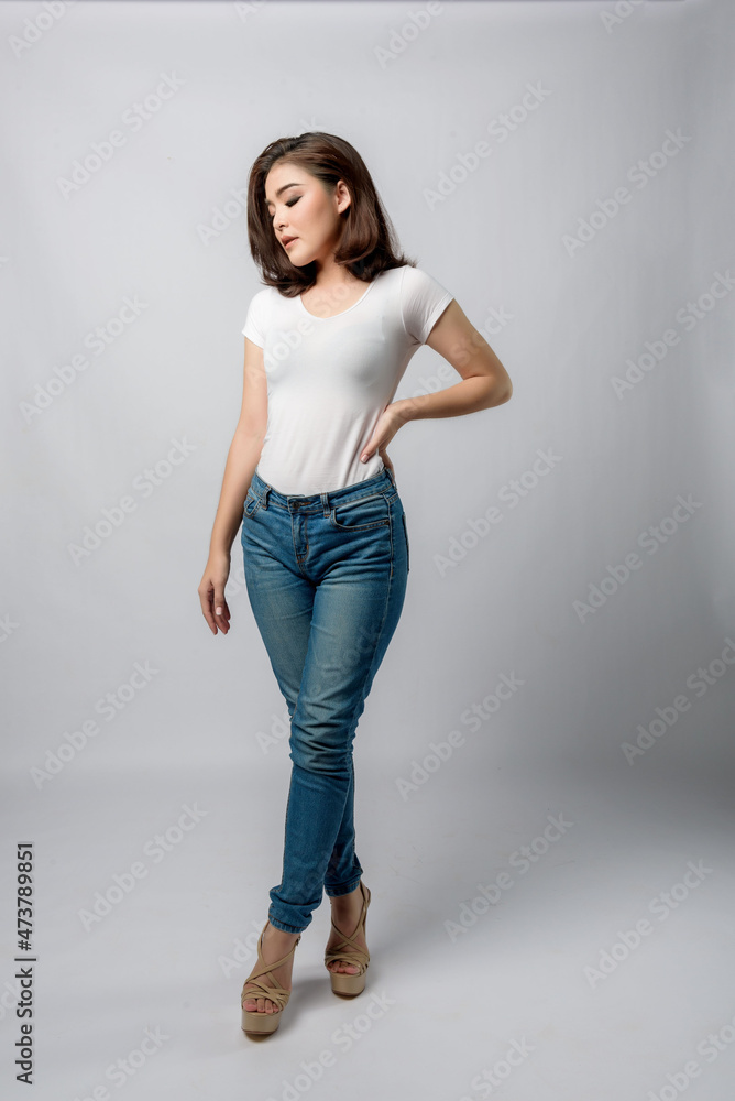 Beautiful female model . High fashion portrait sits in a light studio., isolated on white background. Beautiful female model . High fashion portrait sits in a light studio., isolated on white background.