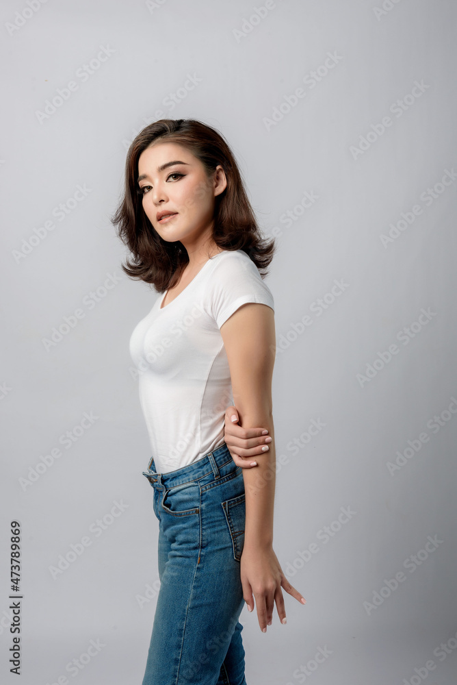 Beautiful female model . High fashion portrait sits in a light studio., isolated on white background. Beautiful female model . High fashion portrait sits in a light studio., isolated on white background.