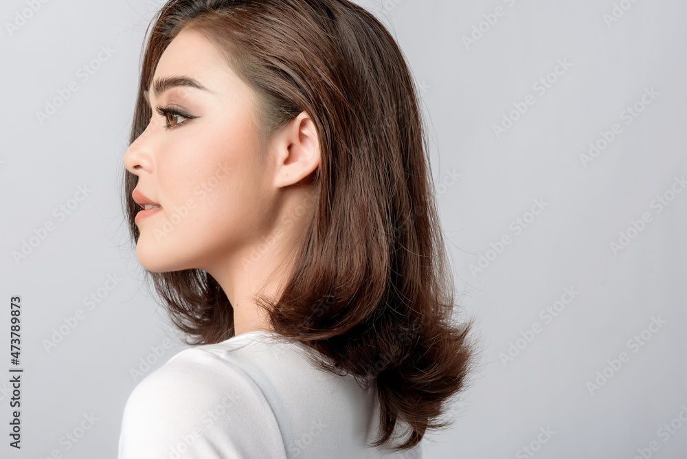 Beautiful female model . High fashion portrait sits in a light studio., isolated on white background. Beautiful female model . High fashion portrait sits in a light studio., isolated on white background.