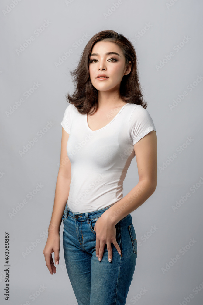 Beautiful female model . High fashion portrait sits in a light studio., isolated on white background. Beautiful female model . High fashion portrait sits in a light studio., isolated on white background.
