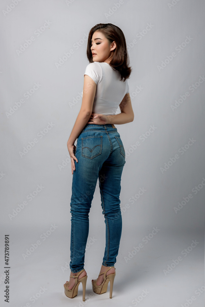 Beautiful female model . High fashion portrait sits in a light studio., isolated on white background. Beautiful female model . High fashion portrait sits in a light studio., isolated on white background.