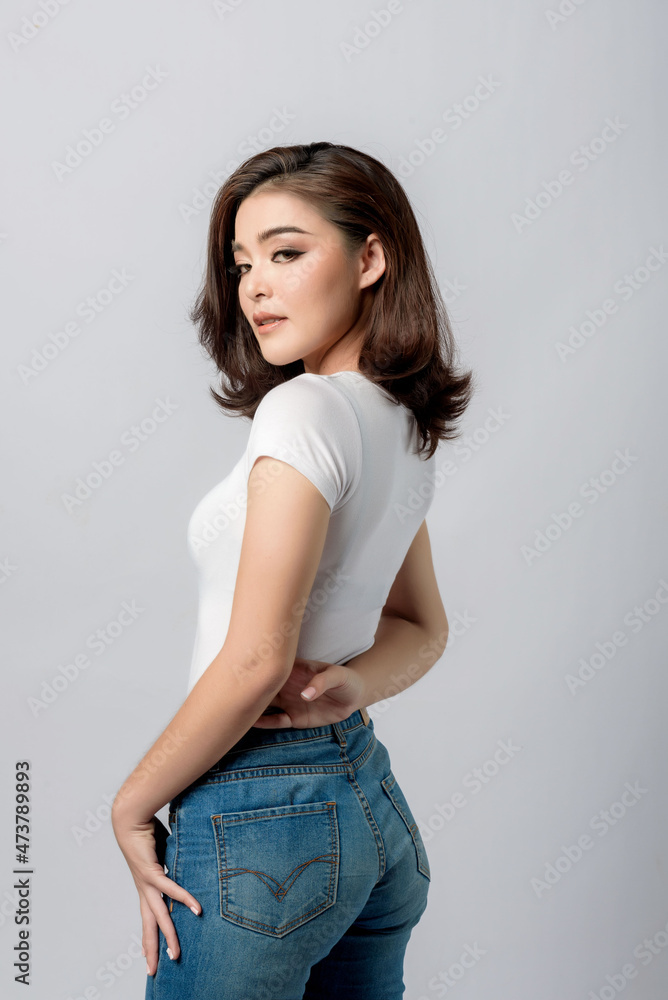 Beautiful female model . High fashion portrait sits in a light studio., isolated on white background. Beautiful female model . High fashion portrait sits in a light studio., isolated on white background.