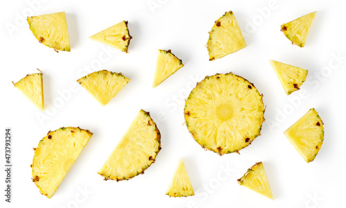 Pineapple pieces isolated on white, from above