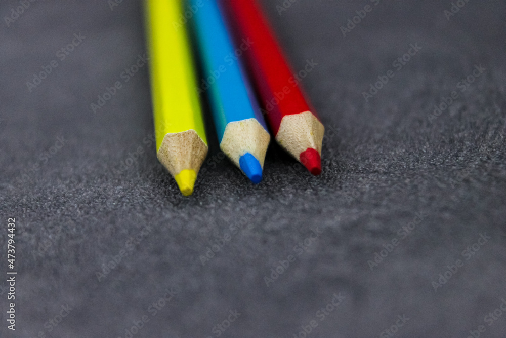 pencils on black background pencils on black background