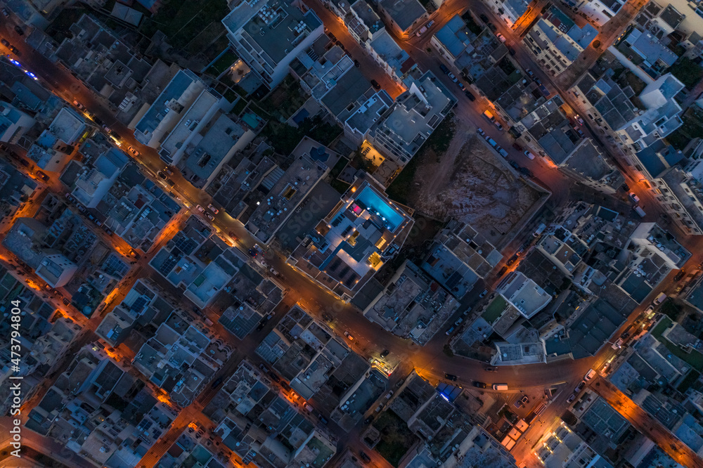 Malta, Northern Region, Mellieha, Aerial view of town rooftops at dusk Malta, Northern Region, Mellieha, Aerial view of town rooftops at dusk