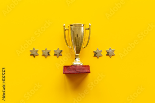 Five stars rating and winner trophy cup. Award and success concept