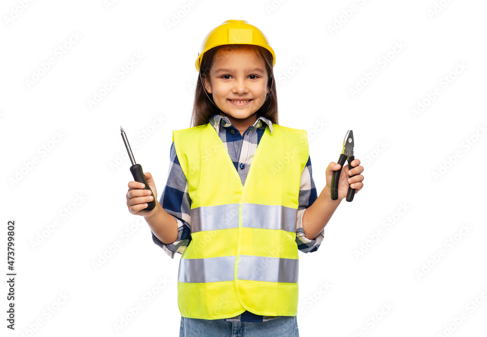 building, construction and profession concept - smiling little girl in protective helmet and safety vest with tools over white background building, construction and profession concept - smiling little girl in protective helmet and safety vest with tools over white background