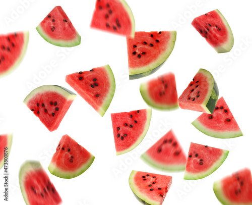Fototapeta Naklejka Na Ścianę i Meble -  Slices of delicious ripe watermelon falling on white background