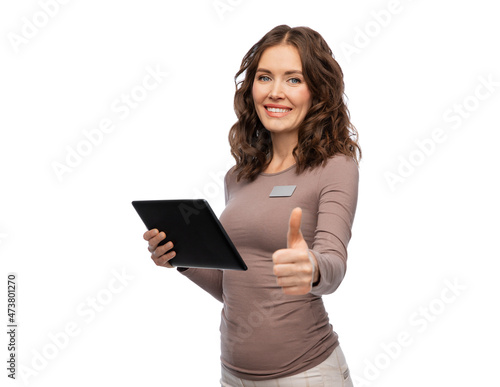 sale, shopping and business concept - happy female shop assistant with tablet pc computer name tag over white background