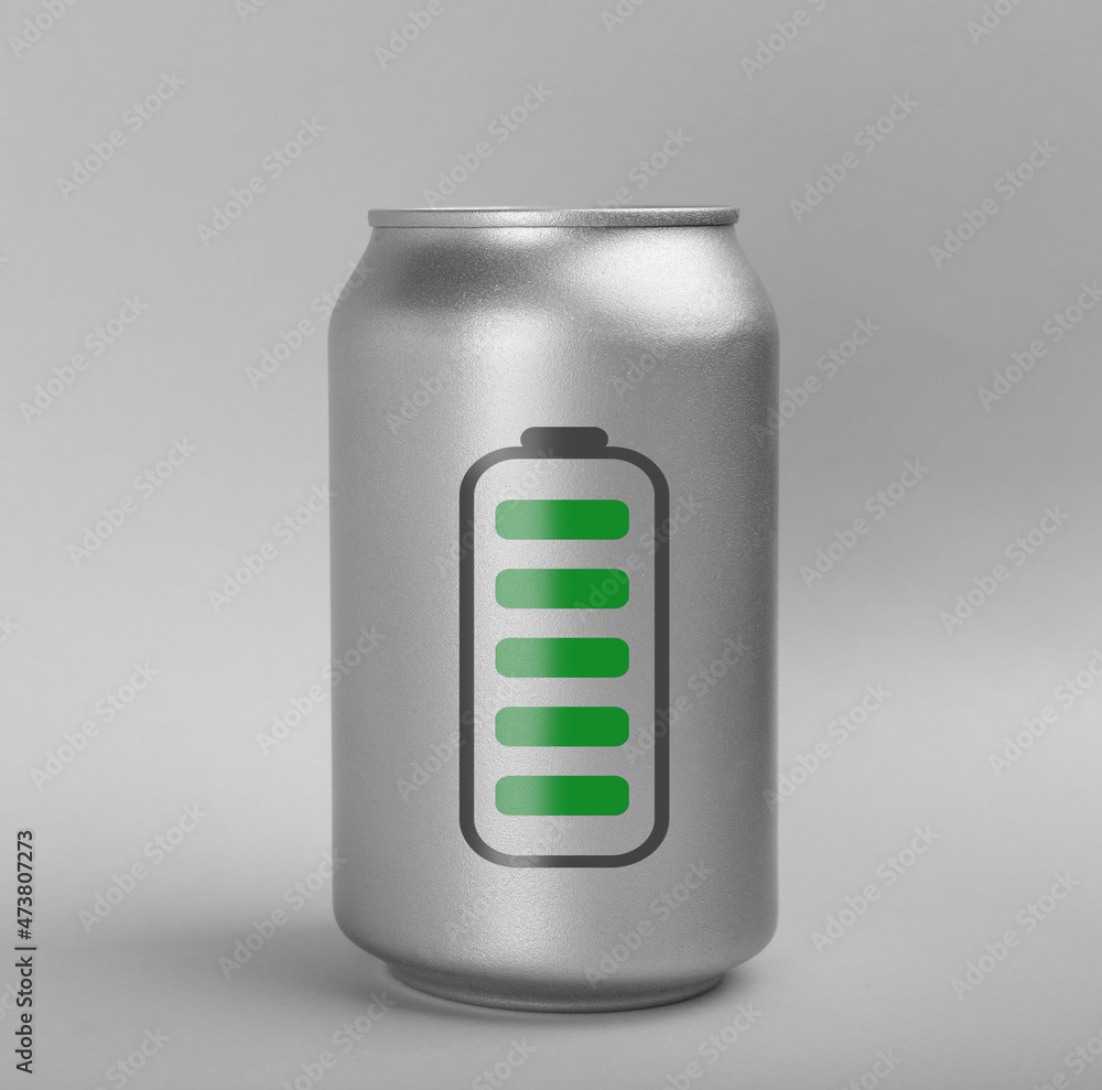 Can of energy drink with picture of fully charged battery on light grey background Can of energy drink with picture of fully charged battery on light grey background