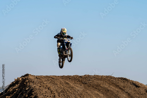 jumping on a motorcycle. motocross. motorcycle racing. bikers on the track