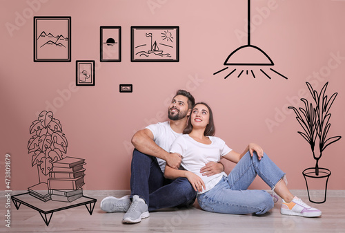 Bilde på lerret Happy couple dreaming about renovation on floor