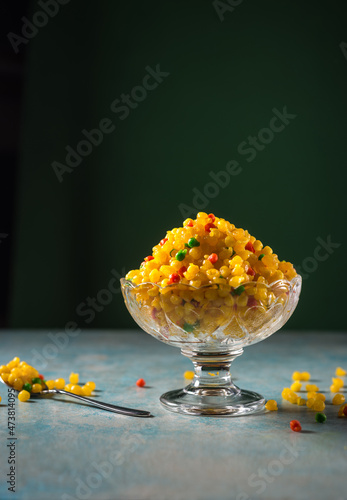 Bundi- a deep fried traditional Indian sweet served in a bowl. Indian dessert and sweet. photo