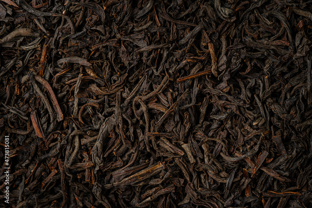 Close up of dry black tea background. Top view